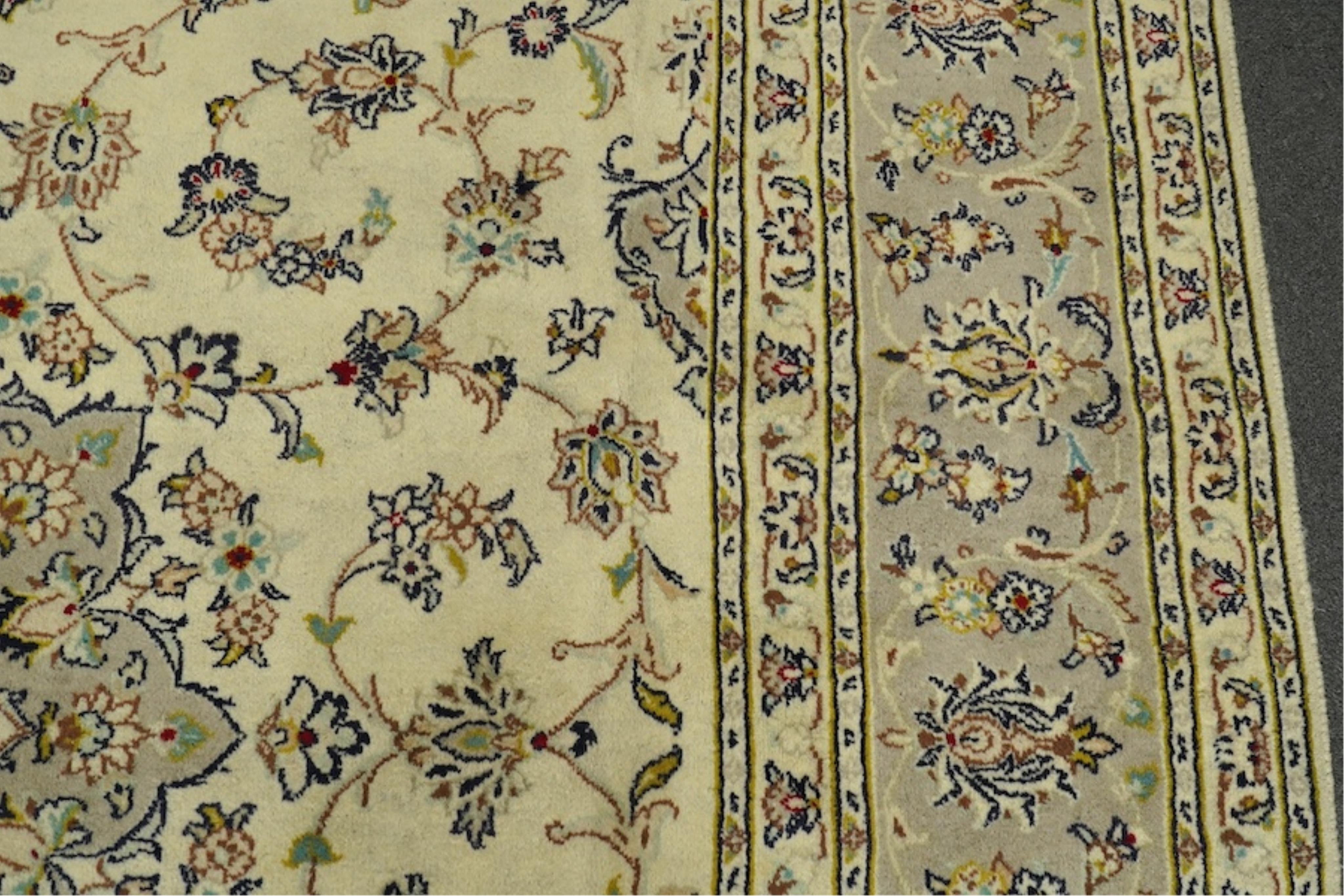 A Kashan ivory ground carpet, 300 x 195cm. Condition - good